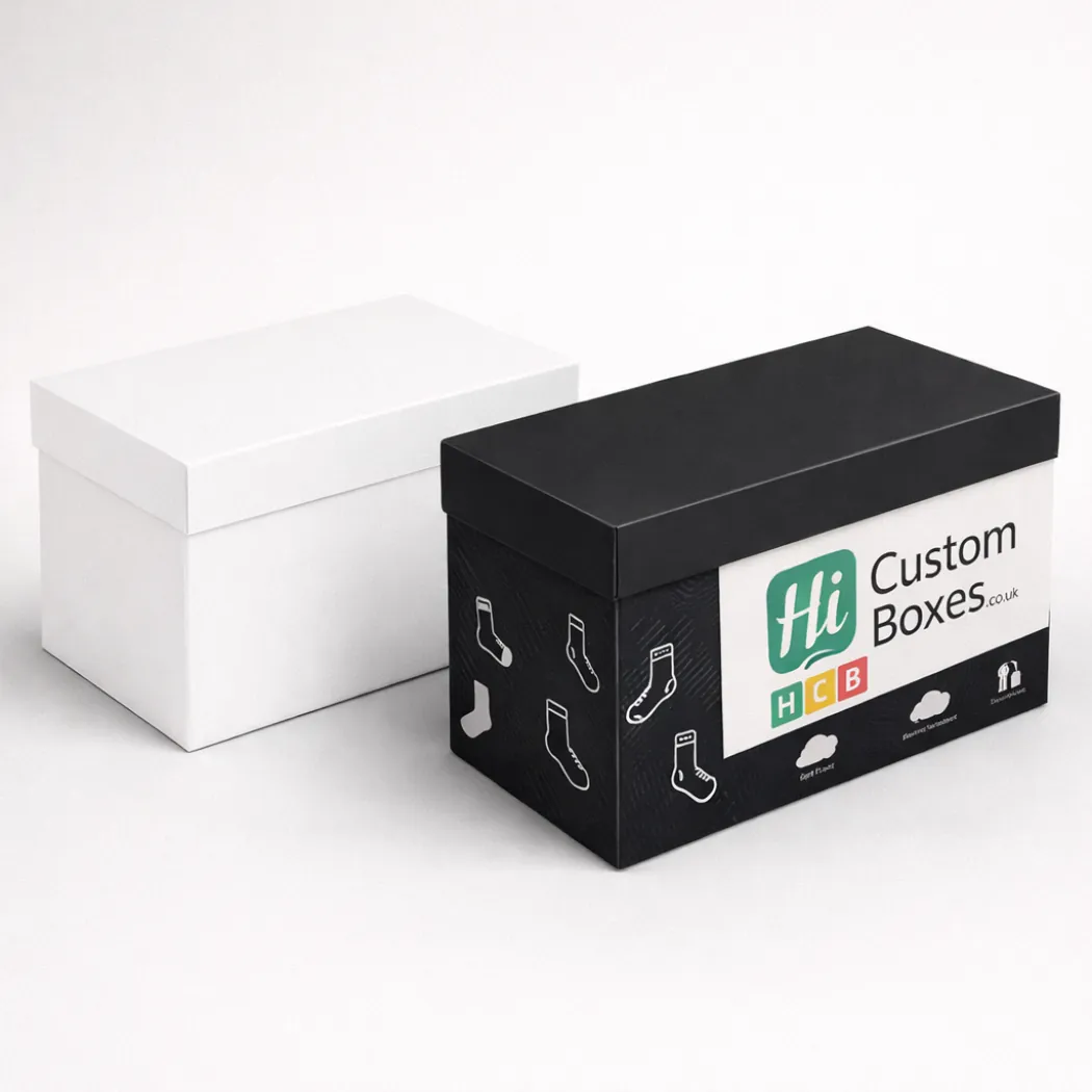 A plain white two-piece rigid box next to a black and white branded lid box- class=